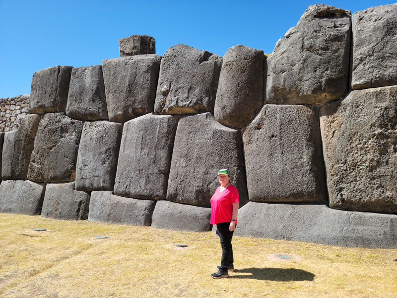 Beth in front of wall at Sacsayhuamán Peru